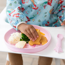 Load image into Gallery viewer, A child reaches for a dino nugget from Bumkins Silicone Plate + Spoon Set: Disney Princess with mashed potatoes and broccoli.

