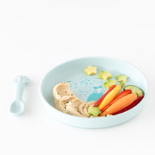 Load image into Gallery viewer, Bumkins Silicone Plate + Spoon Set: Disney Princess Ariel filled with hummus, cucumber, and baby carrots on a white background.

