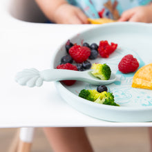 Load image into Gallery viewer, Bumkins Silicone Plate + Spoon Set: Disney Princess Ariel, filled with broccoli, berries, and a pancake, sits on a highchair tray.
