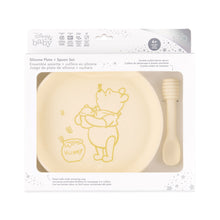 Load image into Gallery viewer, Bumkins Silicone Plate + Spoon Set: Disney Winnie the Pooh is shown in a packaging box, with a clear window displaying the plate and spoon.

