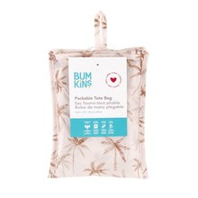 Load image into Gallery viewer, Bumkins Packable Tote Bag: Palm Daze is folded with its packaging tag.
