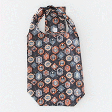 Load image into Gallery viewer, A Bumkins Packable Tote Bag: Ghostly Gallery folds itself into its pocket on a white background in a stop motion GIF.
