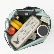 Load image into Gallery viewer, Groceries are removed from a Bumkins Packable Tote Bag: Rich Black in a stop motion GIF.
