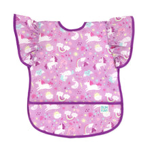 Load image into Gallery viewer, Bumkins Ruffle Apron Bib: Unicorns features purple waterproof fabric with a unicorn pattern, ruffle sleeves, purple trim, and front pocket.
