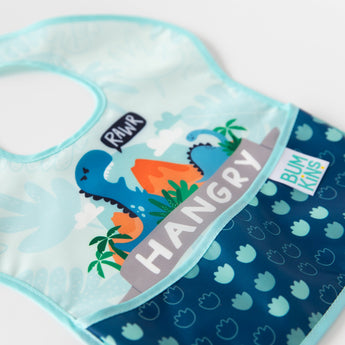 Close-up of a bib from Bumkins SuperBib® and Sleeved Bib 3-Piece Set: Hangry, Dinosaurs, Blue Tropics laid flat on a white background.