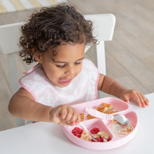 Load image into Gallery viewer, A curly-haired child enjoys fruit and yogurt from a pink plate on a white table, wearing a pink Bumkins SuperBib® 3 Pack: Love You Bunches.
