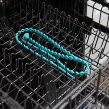 Load image into Gallery viewer, Bumkins Silicone Accessory Tether 2-Pack: Blue sits in the top rack of an open dishwasher.
