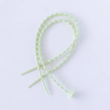 Load image into Gallery viewer, Bumkins Silicone Accessory Tether 2-Pack: Sage rests overlapped on a white background.
