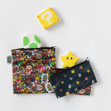 Load image into Gallery viewer, Bumkins Reusable Snack Bag, 3-Pack: Super Mario™ Power Up lays on a white background with video game icon shaped cookies.

