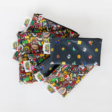 Load image into Gallery viewer, Two sets of Bumkins Reusable Snack Bag, 3-Pack: Super Mario™ Power Up lay stacked on a white background.
