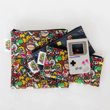 Load image into Gallery viewer, A Nintendo Game Boy-shaped teether lays on top of Bumkins Reusable Snack Bag, 3-Pack: Super Mario™ Power Up on a white background.
