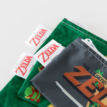 Load image into Gallery viewer, Close-up of Bumkins Reusable Snack Bag, 3-Pack: The Legend of Zelda™ on a white background, with focus on the logo label.
