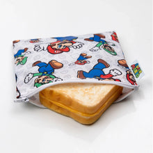 Load image into Gallery viewer, Bumkins Reusable Snack Bag, Large: Super Mario™ &amp; Luigi holds a grilled cheese sandwich on a white background.
