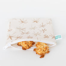 Load image into Gallery viewer, A Bumkins Reusable Snack Bag, Large 2 Pack: Palm Check, partially open to reveal cookies on a white background.
