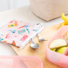 Load image into Gallery viewer, A Roamio by Bumkins Reusable Snack Bag, Large 2 Pack: Disco Boots with utensils sits on a cutting board next to a bento box with apple slices.
