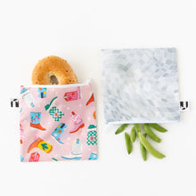 Load image into Gallery viewer, Roamio by Bumkins Reusable Snack Bag, Large 2 Pack: Disco Boots holds a bagel and pea pods on a white background.
