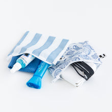 Load image into Gallery viewer, Bumkins Reusable Snack Bag, Large 2 Pack: Coastal lays open on a white background with camera cleaning supplies and charging cords inside.
