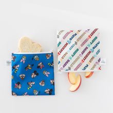Load image into Gallery viewer, Bumkins Reusable Snack Bag, Large 2 Pack: Mickey &amp; Friends MVP lays on a white background with a heart-shaped sandwich &amp; apple slices inside.
