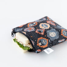 Load image into Gallery viewer, A Bumkins Reusable Snack Bag, Large 2 Pack: Everyday Is Halloween rests on a white background with a sandwich inside.
