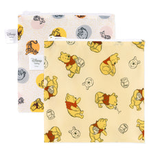 Load image into Gallery viewer, Bumkins Reusable Snack Bag, Large 2 Pack: Pooh Bear and Friends features two waterproof zippered bags with Winnie the Pooh designs.
