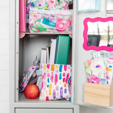 Load image into Gallery viewer, An open locker with school supplies, Bumkins Reusable Snack Bag, Large 2-Pack: Watercolor &amp; Brush Strokes, and a pink mirror on the door.
