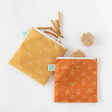 Load image into Gallery viewer, Bumkins Reusable Snack Bag, Large 2-Pack: Sunshine and Grounded on a white background, filled with pretzels and flower-shaped sandwiches.
