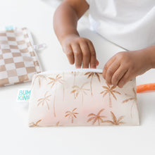 Load image into Gallery viewer, A child's hand reaches into a Bumkins Reusable Snack Bag, Small 2 Pack: Palm Check on a white table.
