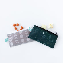 Load image into Gallery viewer, Bumkins Reusable Snack Bag, Small 2 Pack: Desert Night sits on a white background, with star and cactus shaped snacks spilling out of the top.
