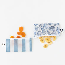 Load image into Gallery viewer, Dried apricots and banana slices spill from Roamio by Bumkins Reusable Snack Bag, Small 2 Pack: Coastal on a white backgorund.
