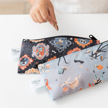 Load image into Gallery viewer, A child holds a cookie near Bumkins Reusable Snack Bag, Small 2 Pack: Everyday Is Halloween on a white table.
