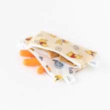 Load image into Gallery viewer, Bumkins Reusable Snack Bag, Small 2 Pack: Pooh Bear and Friends are angled on a white background, filled with carrots and cookies.
