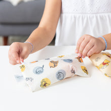 Load image into Gallery viewer, A child zips a Bumkins Reusable Snack Bag, Small 2 Pack: Pooh Bear and Friends on a white table.
