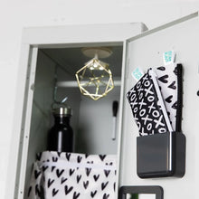 Load image into Gallery viewer, An open locker with a black bottle, geometric decor, and Bumkins Reusable Snack Bag, Small 2-Pack: XOXO &amp; Hearts in a bin on the door.
