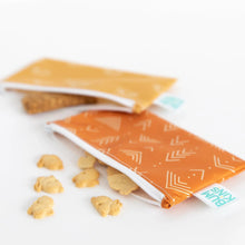 Load image into Gallery viewer, Bumkins Reusable Snack Bag, Small 2-Pack: Sunshine and Grounded lays partially open on a white background with snacks spilling out.
