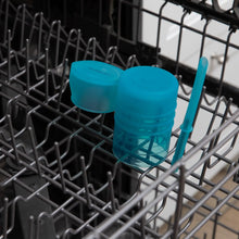 Load image into Gallery viewer, Bumkins Silicone Straw Cup with Lid: Blue sits in the top rack of an open dishwasher.
