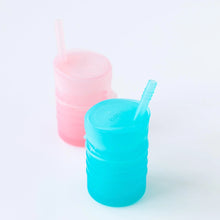 Load image into Gallery viewer, Bumkins Silicone Straw Cup with Lid: Blue sits in front of a pink cup on a white background.
