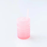 Bumkins Silicone Straw Cup with Lid: Pink sits on a white background.