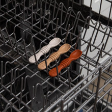 Load image into Gallery viewer, Bumkins Silicone Dipping Spoons 3 Pack: Rocky Road sits in the top rack of an open dishwasher.
