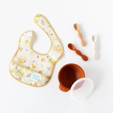 Load image into Gallery viewer, Bumkins Silicone Dipping Spoons 3 Pack: Rocky Road, a bowl with a transparent lid, and a colorful bib are arranged on a white background.
