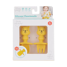 Load image into Gallery viewer, Bumkins Silicone Chewtensils®: Winnie The Pooh are shown in a white packaging box, with a clear front window displaying the product.

