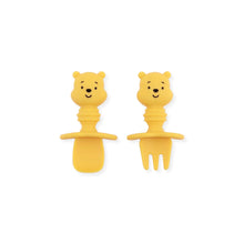Load image into Gallery viewer, Bumkins Silicone Chewtensils®: Winnie The Pooh features a yellow silicone spoon and fork with bear head-shaped handles with faces.
