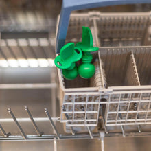 Load image into Gallery viewer, Bumkins Silicone Chewtensils®: Jade sits in the utensil compartment of an open dishwasher.
