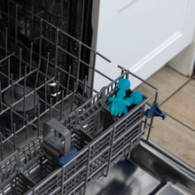 Load image into Gallery viewer, Bumkins Silicone Chewtensils®: Blue Jelly sit in the utensil compartment of an open dishwasher.
