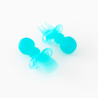 Bumkins Silicone Chewtensils®: Blue Jelly are displayed on a white background with one face-down, showcasing sensory bumps on the back.