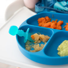 Load image into Gallery viewer, Close-up of a blue divided baby plate with carrots &amp; puree on a highchair tray, paired with Bumkins Silicone Chewtensils®: Blue Jelly.
