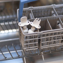 Load image into Gallery viewer, Bumkins Silicone Chewtensils®: Marble sits in the utensil compartment of an open dishwasher.
