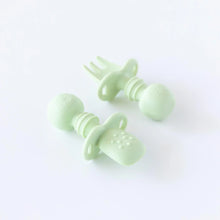 Load image into Gallery viewer, Bumkins Silicone Chewtensils®: Sage rests on a white background; one lays face-down, showcasing the sensory bumps on the back.
