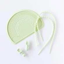 Load image into Gallery viewer, Bumkins Silicone Chewtensils®: Sage lays near a green silicone placemat and two green silicone tethers on a white background.

