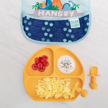 Load image into Gallery viewer, An orange plate with eggs, raspberries, and yogurt sits beside Bumkins Silicone Chewtensils®: Tangerine and a blue bib on a marble surface.
