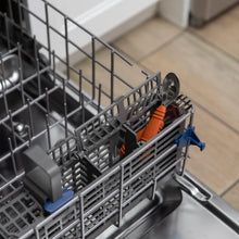 Load image into Gallery viewer, Bumkins Spoon + Fork: Clay sits in the utensil compartment of an open dishwasher.
